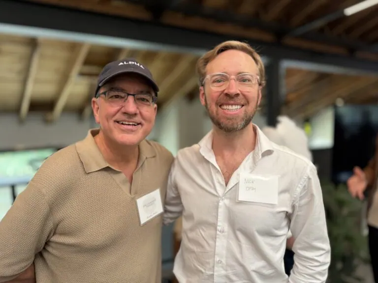 Nick Gray and a friend at an event, both wearing name tags